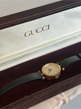 Gucci Gold-Tone Watch with Black Strap - great condition